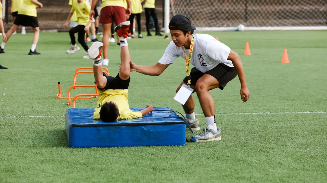 Players doing agility drills on a field